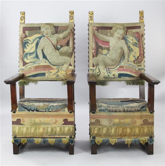 A pair of late 17th century walnut armchairs,